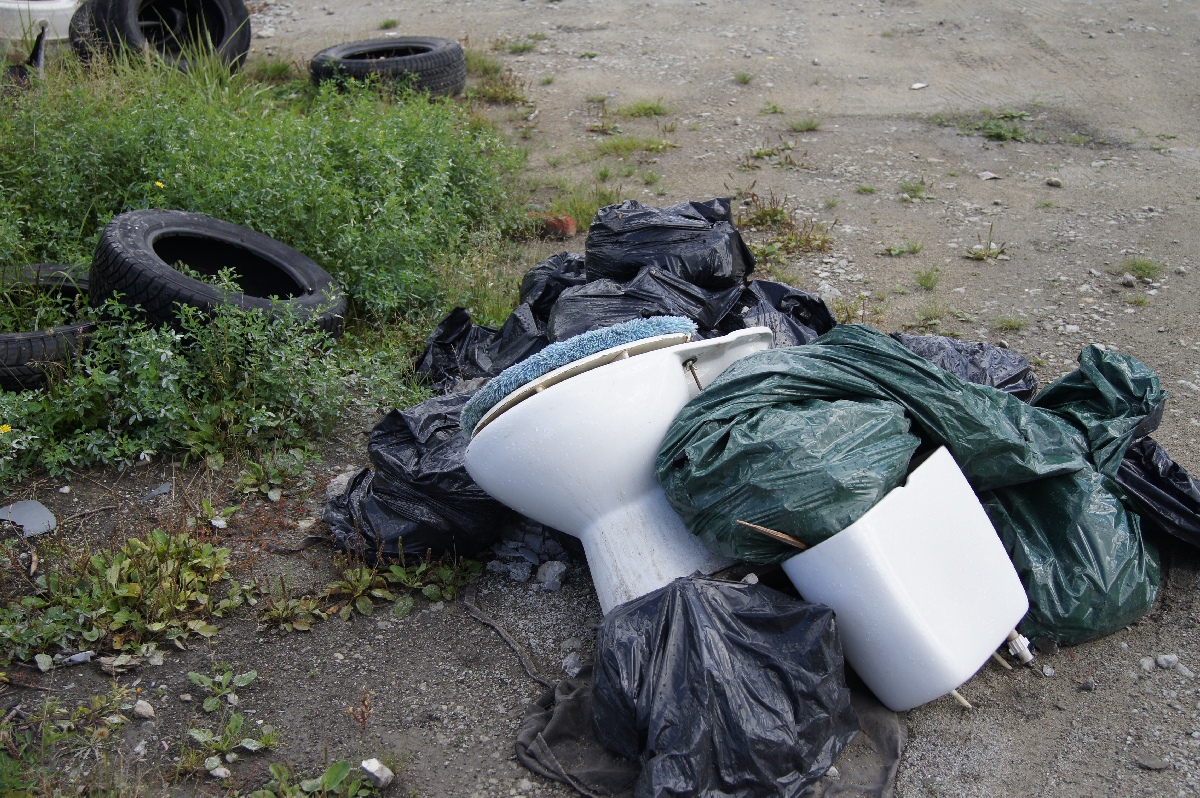 Heaps of garbage next to the car market. Astangu Military Base.