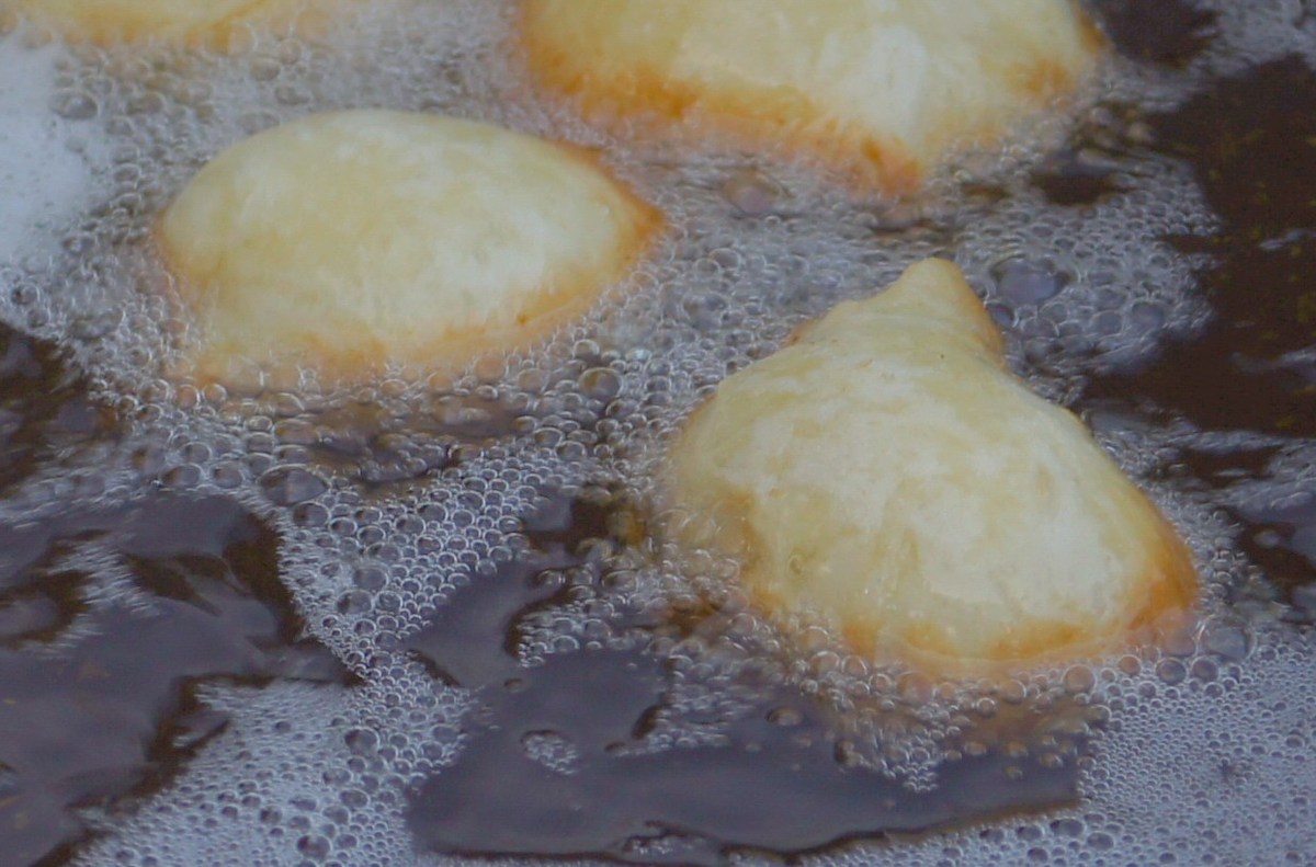 Dough pieces are fried in oil.  Pärnu Grillfest.
